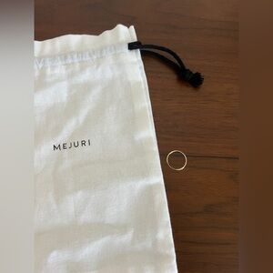 Mejuri between hoop earring